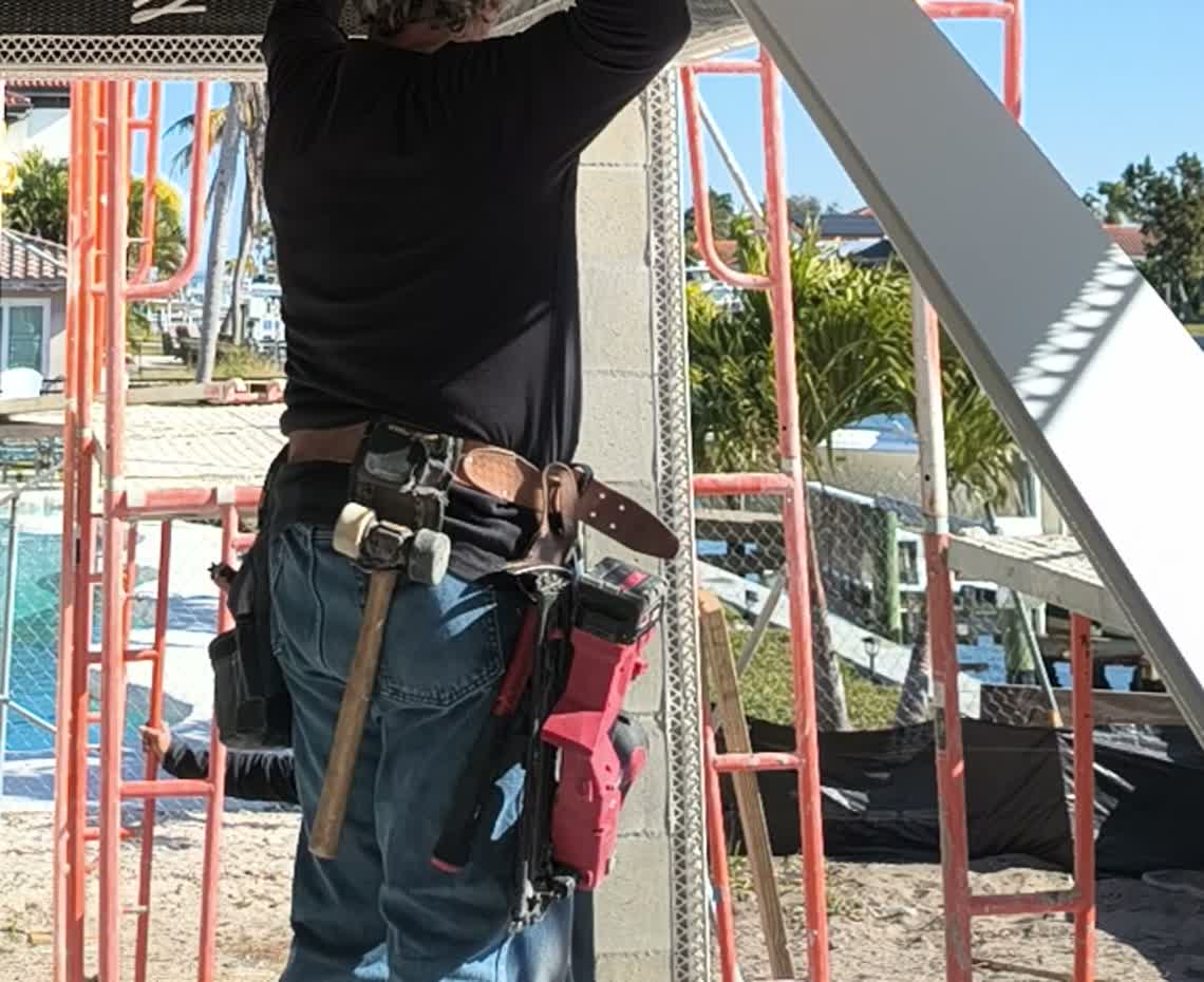 Carpenter tool belt with mallet, hammer, and Milwaukee nailer