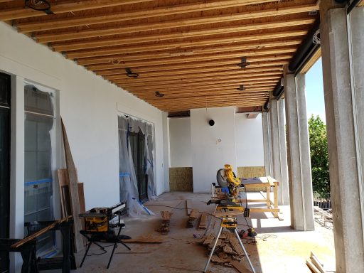 Open truss framing on Herb's lanai with miter saw and table saw set up